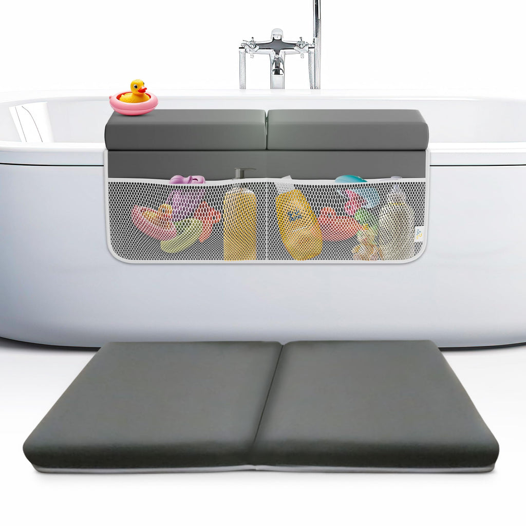 Gray bath tub with a mesh organizer and colorful toys inside, placed over a white bathtub.